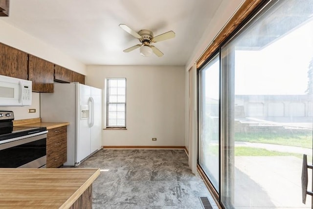 758 Sizer Rd, Gurnee, IL 60031 - kitchen with white appliances, ceiling fan, and light countertops