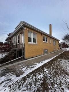 7156 S Artesian Ave, Chicago, IL 60629 - snow covered property featuring a chimney