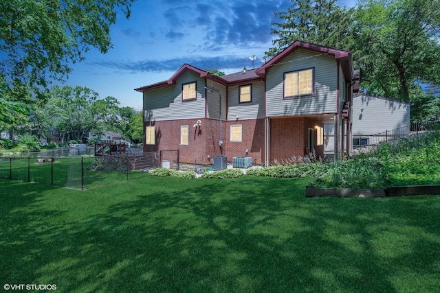 236 Forest Dr, Island Lake, IL 60042 - back of property featuring brick siding and a fenced backyard