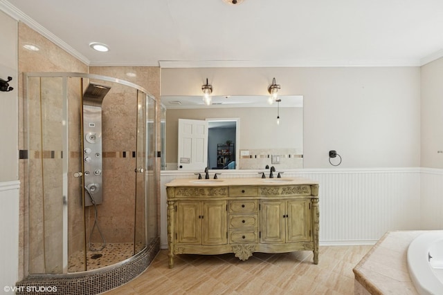 236 Forest Dr, Island Lake, IL 60042 - bathroom featuring a bath, a stall shower, wainscoting, double vanity, and ornamental molding