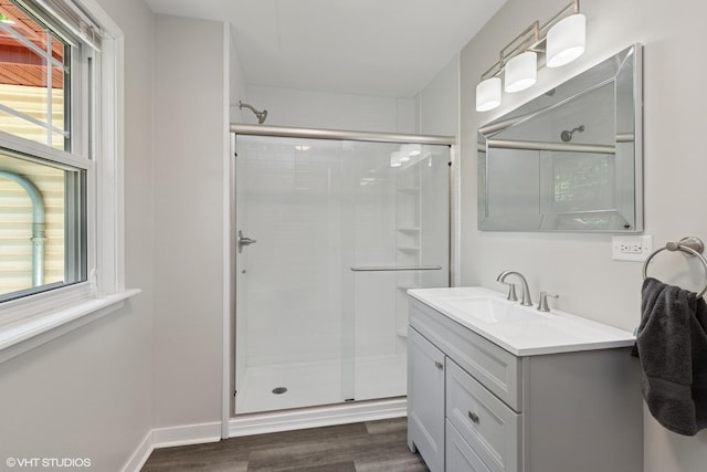 236 Forest Dr, Island Lake, IL 60042 - full bathroom with a stall shower, vanity, and wood finished floors