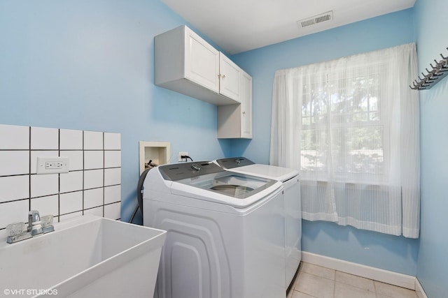 236 Forest Dr, Island Lake, IL 60042 - laundry area featuring cabinet space, independent washer and dryer, and light tile patterned flooring