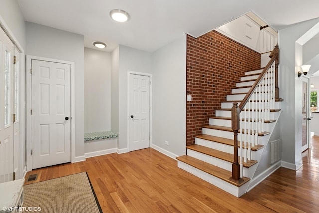 236 Forest Dr, Island Lake, IL 60042 - stairway with wood finished floors and baseboards