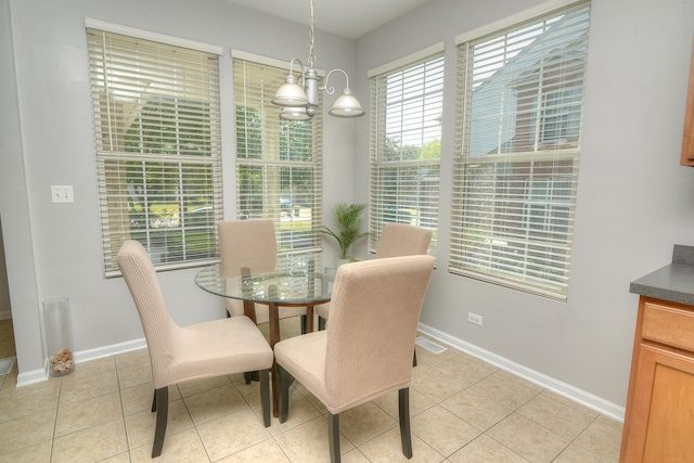1420 Yellowstone Dr, Streamwood, IL 60107 - dining area featuring light tile patterned floors and a chandelier