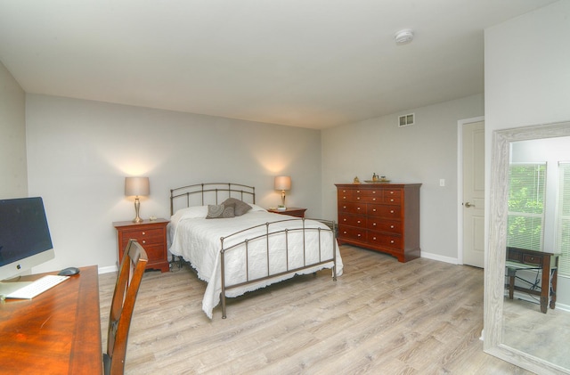 1420 Yellowstone Dr, Streamwood, IL 60107 - bedroom with light wood finished floors and baseboards