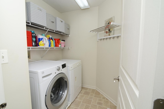 1420 Yellowstone Dr, Streamwood, IL 60107 - laundry room featuring washing machine and clothes dryer and baseboards