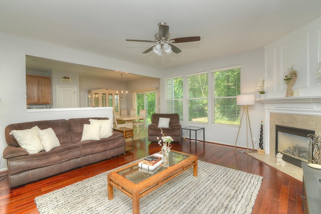 1420 Yellowstone Dr, Streamwood, IL 60107 - living room featuring ceiling fan, wood-type flooring, a fireplace, and a chandelier