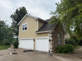 513 Pond Gate Dr, Barrington, IL 60010 - view of side of property featuring driveway and an attached garage