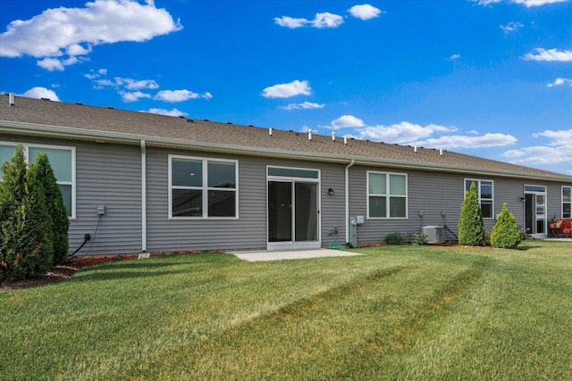927 Darwin St, North Aurora, IL 60542 - back of house with a lawn