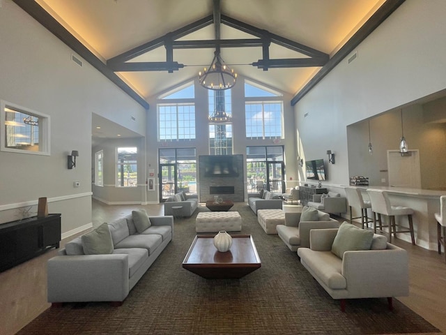927 Darwin St, North Aurora, IL 60542 - living room with high vaulted ceiling, a chandelier, and carpet floors