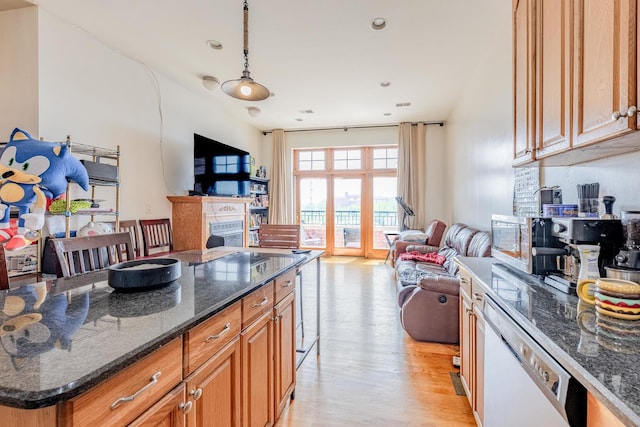 1918 W Cermak Rd Unit 4, Chicago, IL 60608 - kitchen featuring open floor plan, white dishwasher, light wood-style floors, dark stone counters, and brown cabinets