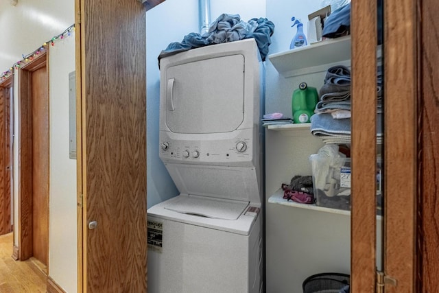 1918 W Cermak Rd Unit 4, Chicago, IL 60608 - laundry room with stacked washer and clothes dryer and wood finished floors