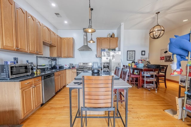 1918 W Cermak Rd Unit 4, Chicago, IL 60608 - kitchen featuring appliances with stainless steel finishes, light wood finished floors, wall chimney range hood, decorative light fixtures, and recessed lighting