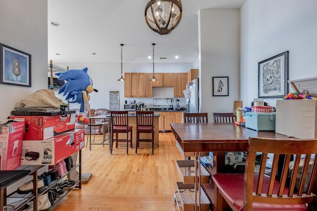 1918 W Cermak Rd Unit 4, Chicago, IL 60608 - dining room with light wood-style flooring, a chandelier, and recessed lighting
