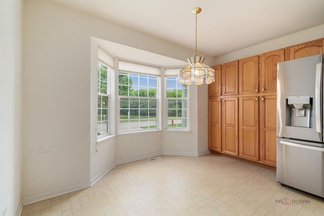707 Wedgewood Trl, Mchenry, IL 60050 - kitchen with stainless steel refrigerator with ice dispenser, a chandelier, and hanging light fixtures