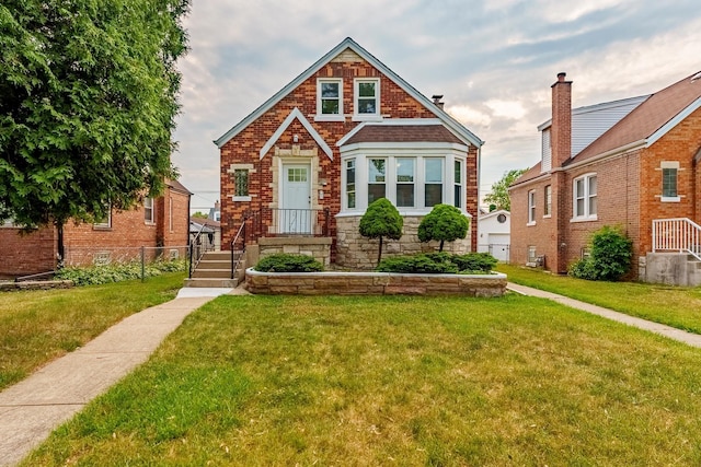3020 77th Ave, Elmwood Park, IL 60707 - view of front of house with a front yard, stone siding, and brick siding