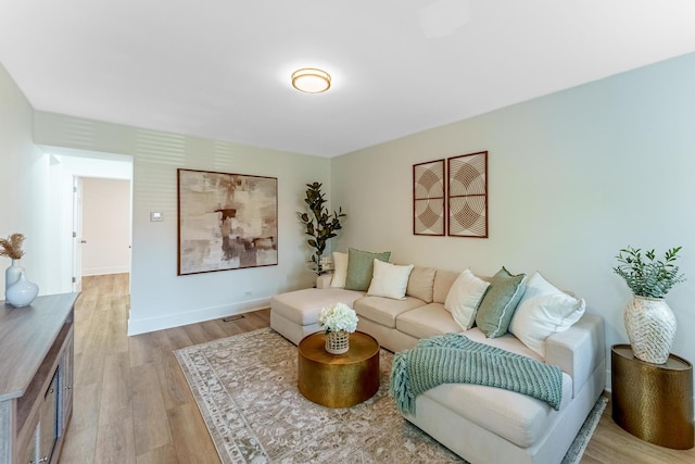3020 77th Ave, Elmwood Park, IL 60707 - living room with light wood finished floors and baseboards