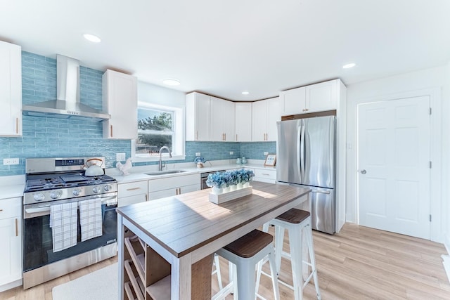 3020 77th Ave, Elmwood Park, IL 60707 - kitchen featuring wall chimney exhaust hood, appliances with stainless steel finishes, light countertops, white cabinetry, and backsplash