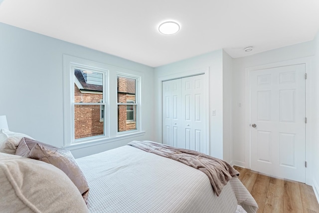 3020 77th Ave, Elmwood Park, IL 60707 - bedroom with light wood-style flooring and a closet