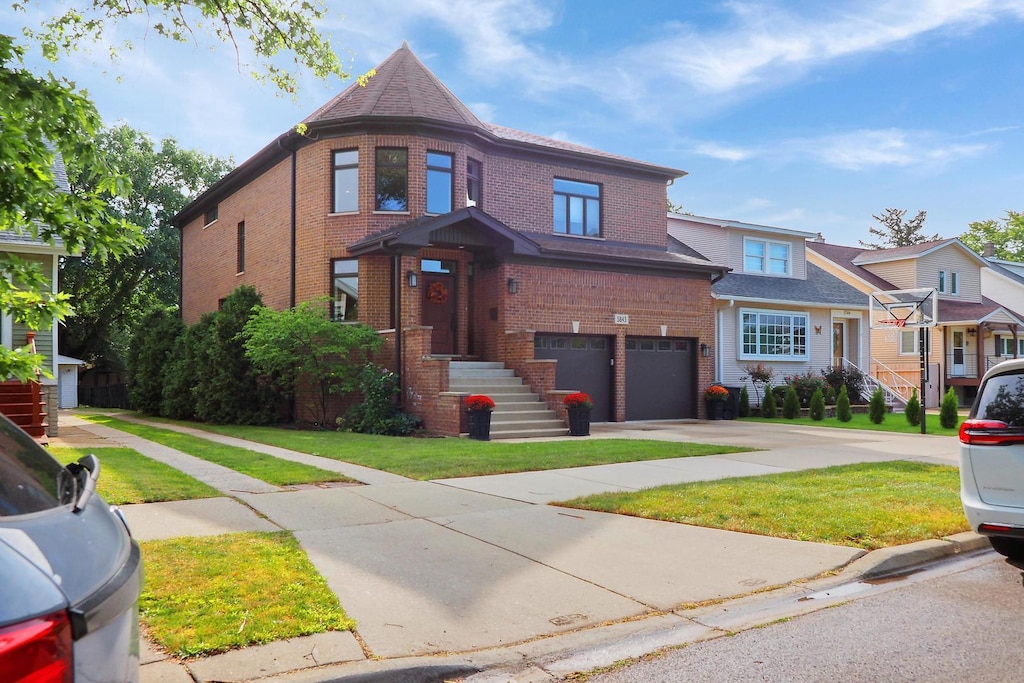 5843 N Oconto Ave, Chicago, IL 60631 - view of front of home with brick siding, driveway, a front yard, and a garage