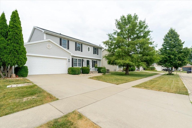 3310 Stonebridge Dr, Bloomington, IL 61704 - view of front of home with a garage, a front lawn, and concrete driveway