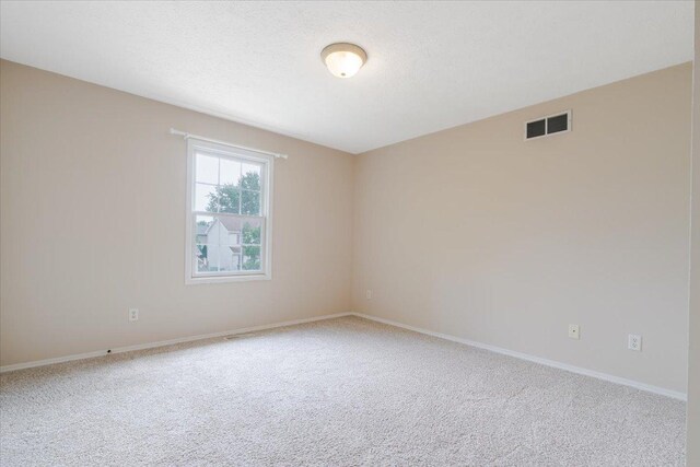 3310 Stonebridge Dr, Bloomington, IL 61704 - carpeted spare room with baseboards