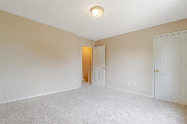 3310 Stonebridge Dr, Bloomington, IL 61704 - unfurnished bedroom with carpet flooring and baseboards