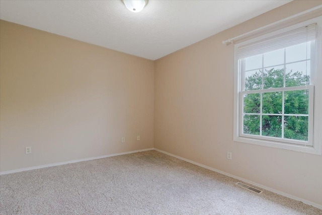 3310 Stonebridge Dr, Bloomington, IL 61704 - carpeted empty room featuring baseboards