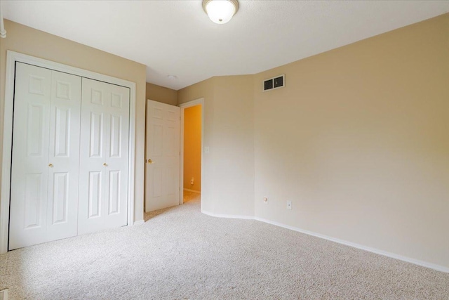 3310 Stonebridge Dr, Bloomington, IL 61704 - unfurnished bedroom featuring carpet and a closet