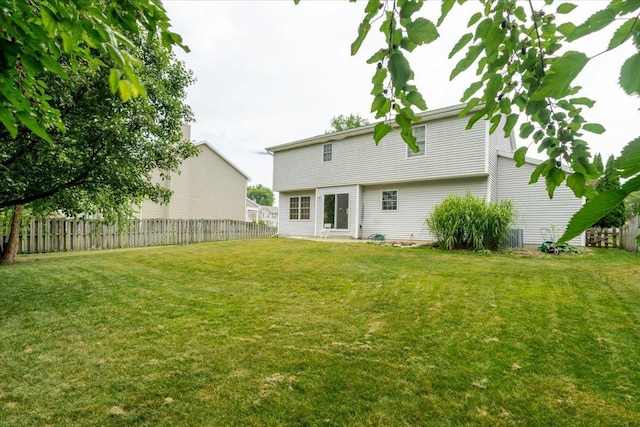 3310 Stonebridge Dr, Bloomington, IL 61704 - rear view of house with a fenced backyard