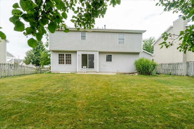 3310 Stonebridge Dr, Bloomington, IL 61704 - rear view of property with a fenced backyard and a patio area