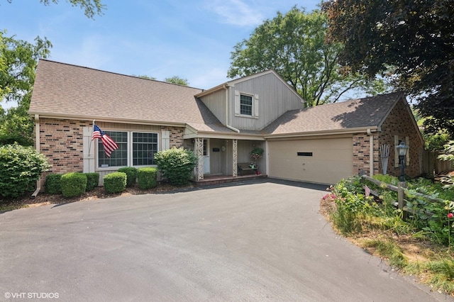 1615 E Miner St, Arlington Heights, IL 60004 - view of front of property featuring brick siding, a garage, driveway, and roof with shingles