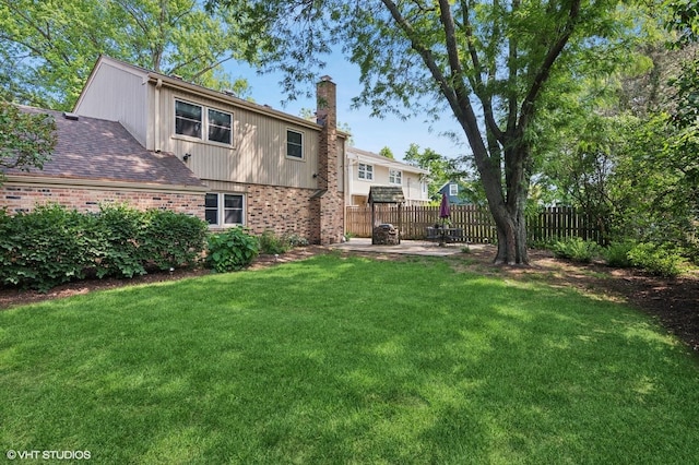 1615 E Miner St, Arlington Heights, IL 60004 - back of property with brick siding, a chimney, and a patio
