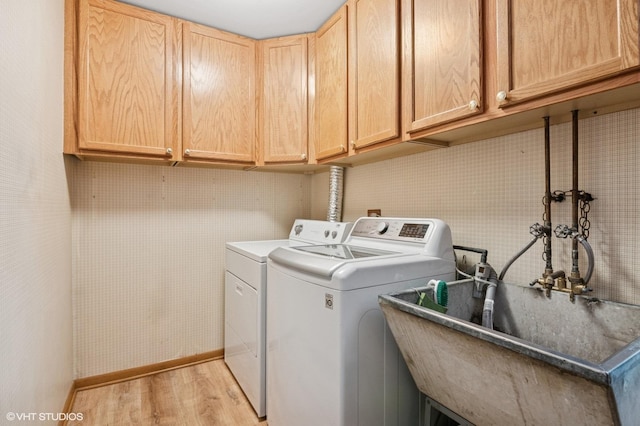 1615 E Miner St, Arlington Heights, IL 60004 - laundry area with light wood-style flooring, washer and clothes dryer, and cabinet space