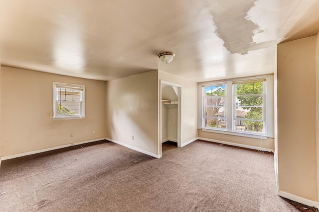 7807 S Burnham Ave, Chicago, IL 60649 - unfurnished bedroom featuring carpet flooring, multiple windows, and a closet