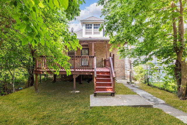 7807 S Burnham Ave, Chicago, IL 60649 - view of front facade with a front lawn, brick siding, a wooden deck, and roof with shingles