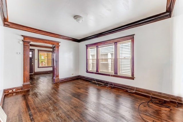 7807 S Burnham Ave, Chicago, IL 60649 - unfurnished room with ornamental molding, dark wood-style floors, and decorative columns