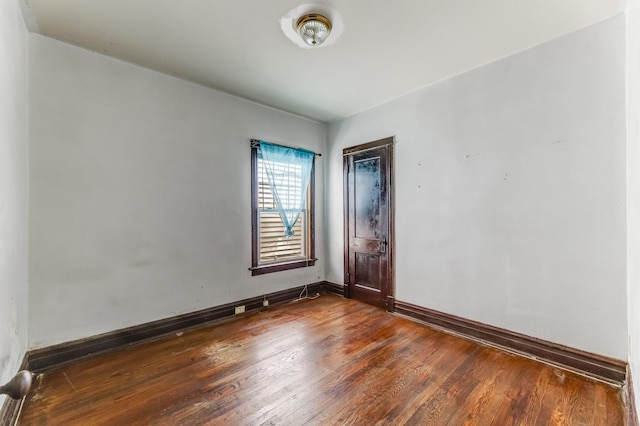 7807 S Burnham Ave, Chicago, IL 60649 - unfurnished room with dark wood-style flooring