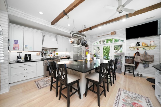 1530 W Monroe St, Chicago, IL 60607 - dining area with beam ceiling, light wood finished floors, a ceiling fan, and recessed lighting