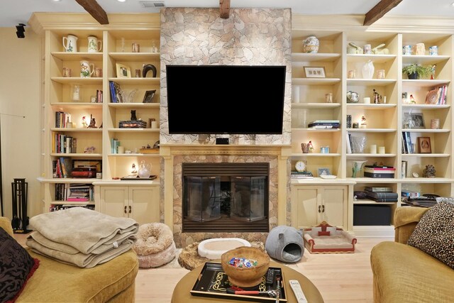 1530 W Monroe St, Chicago, IL 60607 - living room with a large fireplace, wood finished floors, and beamed ceiling