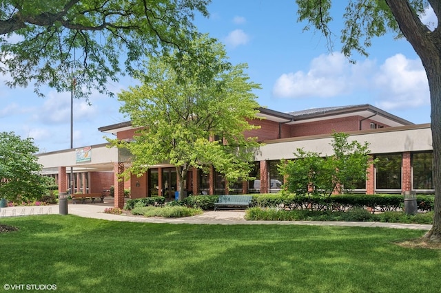 3125 Town Square Dr Unit 408, Rolling Meadows, IL 60008 - back of house with brick siding and a yard