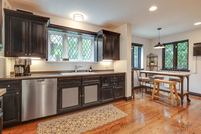670 S Green Bay Rd, Lake Forest, IL 60045 - kitchen with stainless steel dishwasher, decorative backsplash, light wood-style flooring, recessed lighting, and dark countertops