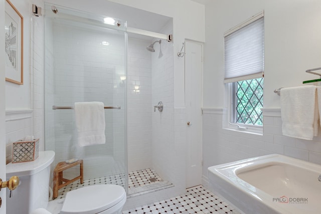 670 S Green Bay Rd, Lake Forest, IL 60045 - full bathroom with tile walls, a shower stall, wainscoting, and tile patterned flooring