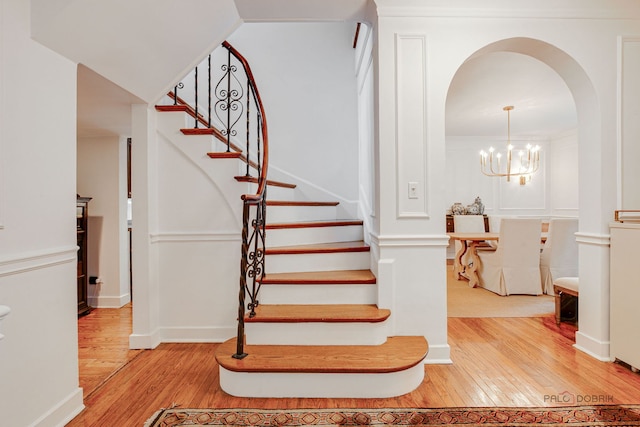 670 S Green Bay Rd, Lake Forest, IL 60045 - stairs with wood-type flooring and arched walkways