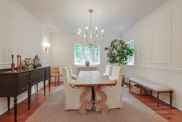 670 S Green Bay Rd, Lake Forest, IL 60045 - dining room featuring wood finished floors, a chandelier, a decorative wall, and ornamental molding