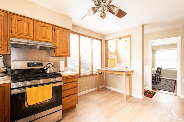 421 W Verret St, Elmhurst, IL 60126 - kitchen featuring stainless steel range with gas cooktop, under cabinet range hood, ceiling fan, and healthy amount of natural light