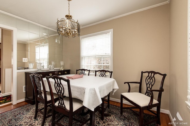 421 W Verret St, Elmhurst, IL 60126 - dining area featuring dark wood-style flooring, a chandelier, and crown molding