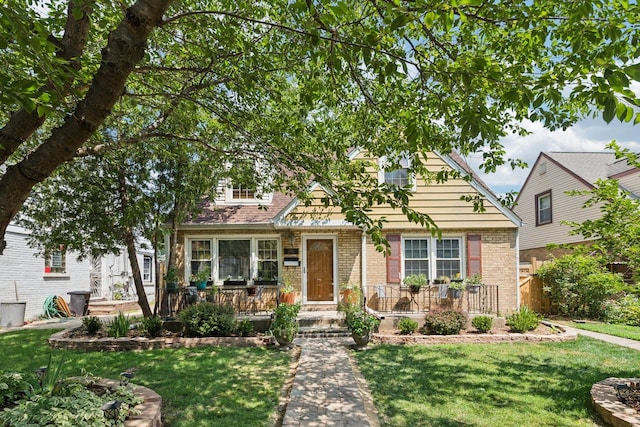 2321 Lee St, Evanston, IL 60202 - view of front of property with brick siding and a front yard