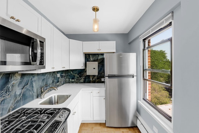 4880 N Marine Dr Unit 404, Chicago, IL 60640 - kitchen featuring stainless steel appliances, decorative backsplash, white cabinetry, and light countertops