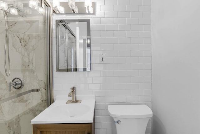 4880 N Marine Dr Unit 404, Chicago, IL 60640 - bathroom with tile walls, vanity, and a shower